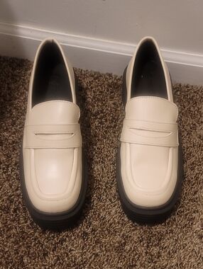 Cream Penny Loafers with Black Lug Sole — Sleek Women's Flats